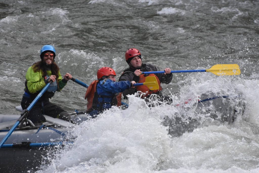 Rafters get splashed as they navigate the whitewater of the Nenana River.