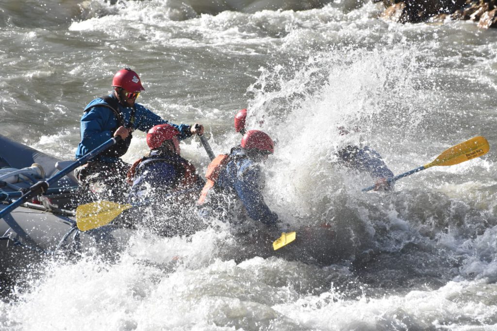 Rafters get splashed as they paddle through the whitewater of the Nenana River.